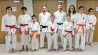 Students wearing their new belts at the first class after a successful grading